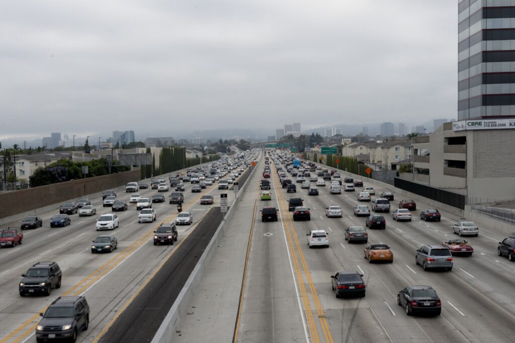 Cars and SUVs fill the lanes of Interstate 405 in Los Angeles on an overcast day
