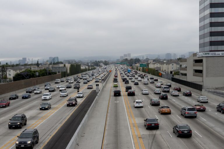 Cars and SUVs fill the lanes of Interstate 405 in Los Angeles on an overcast day